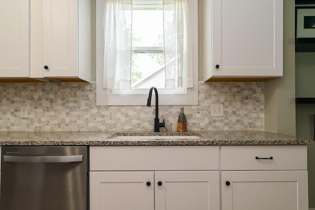 2686 Wicklow Rd, Columbus, OH 43204 - kitchen featuring dishwasher, white cabinetry, healthy amount of natural light, and decorative backsplash