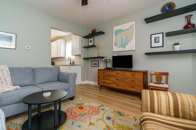 2686 Wicklow Rd, Columbus, OH 43204 - living area with light wood-style flooring and a textured ceiling