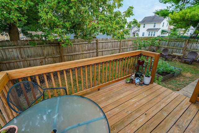 2686 Wicklow Rd, Columbus, OH 43204 - wooden deck featuring a fenced backyard, outdoor dining space, and a residential view