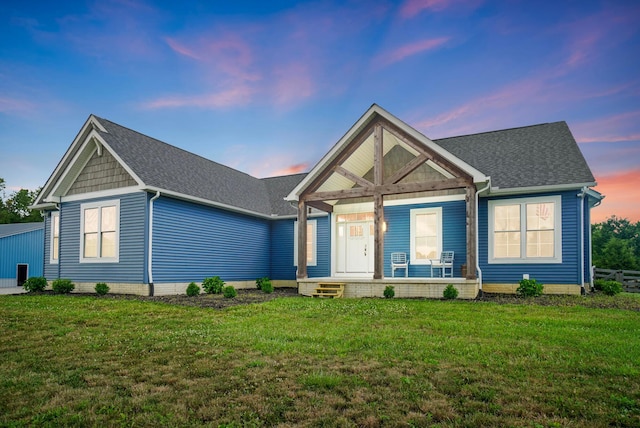 25500 Storms Rd, West Mansfield, OH 43358 - view of front facade featuring a front lawn, roof with shingles, and covered porch
