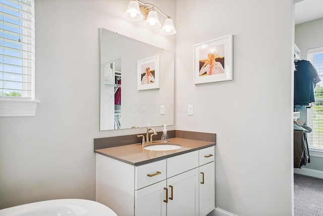25500 Storms Rd, West Mansfield, OH 43358 - bathroom featuring vanity and a walk in closet