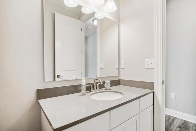 25500 Storms Rd, West Mansfield, OH 43358 - bathroom with vanity and wood finished floors
