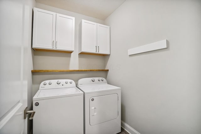 25500 Storms Rd, West Mansfield, OH 43358 - washroom featuring separate washer and dryer and cabinet space