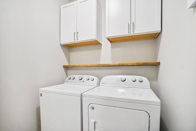 25500 Storms Rd, West Mansfield, OH 43358 - laundry area featuring washing machine and clothes dryer and cabinet space