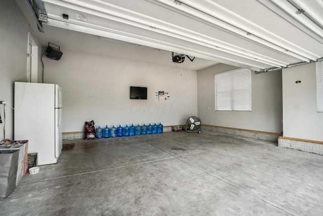 25500 Storms Rd, West Mansfield, OH 43358 - garage with freestanding refrigerator and a garage door opener