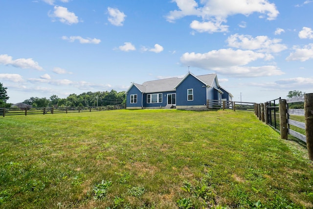 25500 Storms Rd, West Mansfield, OH 43358 - rear view of property with a fenced backyard and a view of rural / pastoral area