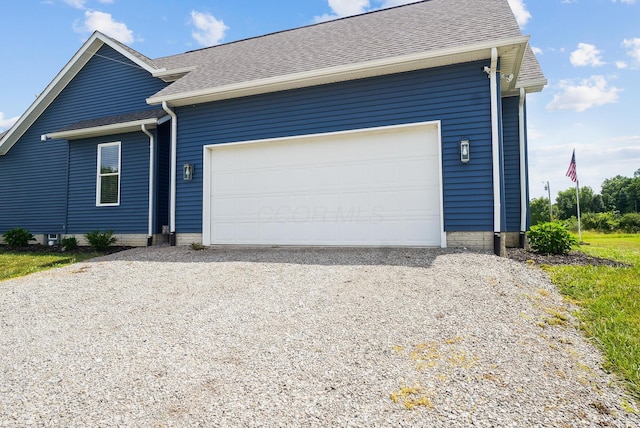 25500 Storms Rd, West Mansfield, OH 43358 - view of front of property featuring a shingled roof, driveway, and an attached garage