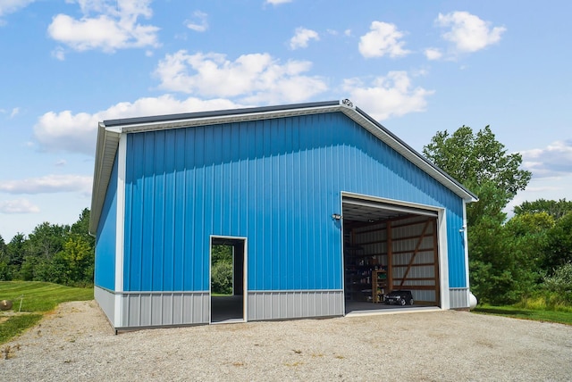 25500 Storms Rd, West Mansfield, OH 43358 - view of home's exterior featuring a garage, an outbuilding, and a pole building