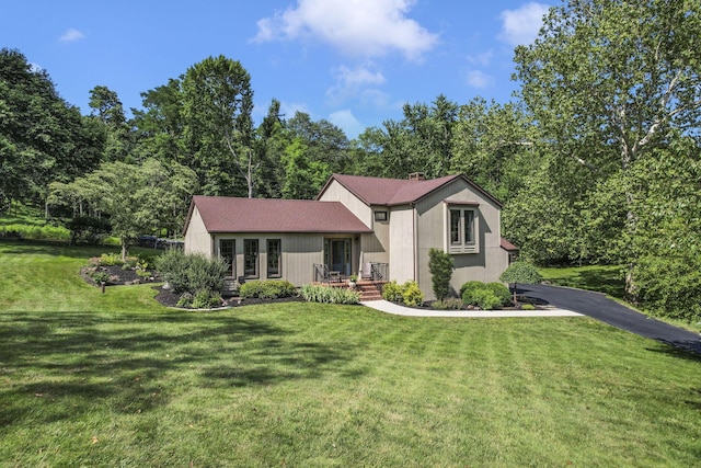 680 Rainbow Dr NW, Lancaster, OH 43130 - view of front of property featuring asphalt driveway and a front lawn