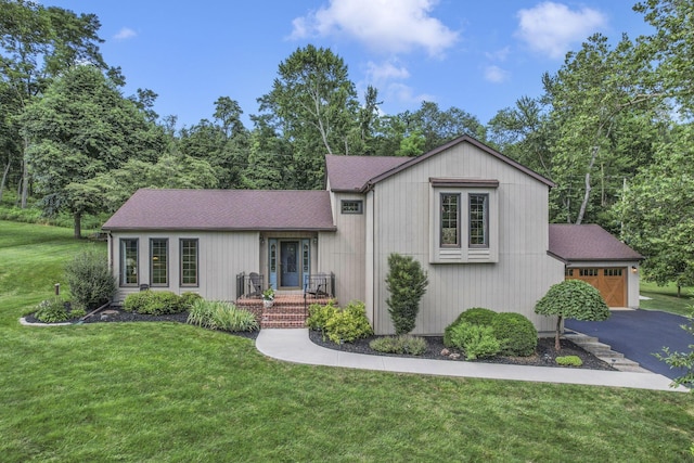 680 Rainbow Dr NW, Lancaster, OH 43130 - view of front facade with a garage, a front lawn, and a shingled roof