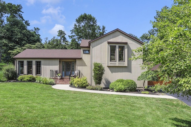 680 Rainbow Dr NW, Lancaster, OH 43130 - view of front of property with a front yard and a shingled roof