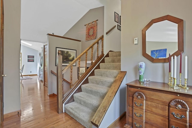 680 Rainbow Dr NW, Lancaster, OH 43130 - stairway with lofted ceiling and wood finished floors