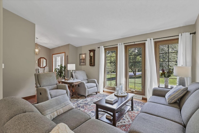 680 Rainbow Dr NW, Lancaster, OH 43130 - living area featuring wood finished floors and vaulted ceiling