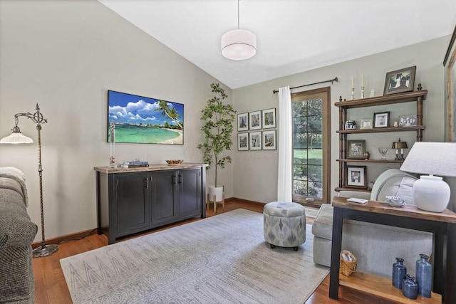 680 Rainbow Dr NW, Lancaster, OH 43130 - living area featuring wood finished floors and lofted ceiling