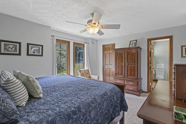 680 Rainbow Dr NW, Lancaster, OH 43130 - bedroom with carpet floors, a textured ceiling, a ceiling fan, and connected bathroom