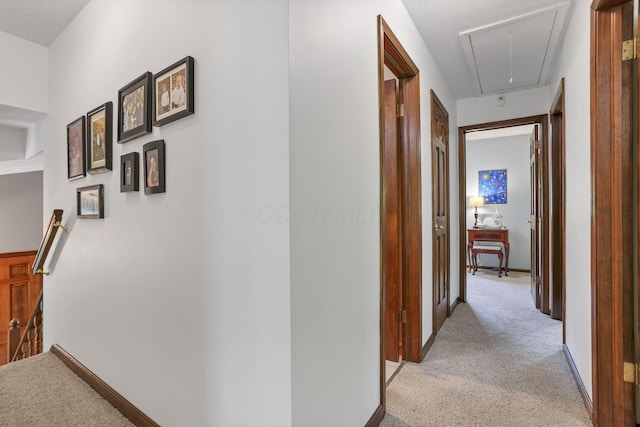680 Rainbow Dr NW, Lancaster, OH 43130 - hallway featuring attic access, light colored carpet, and an upstairs landing