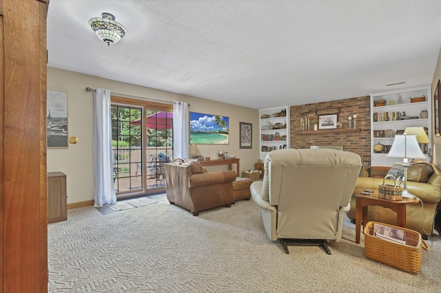 680 Rainbow Dr NW, Lancaster, OH 43130 - carpeted living area with built in shelves and a textured ceiling