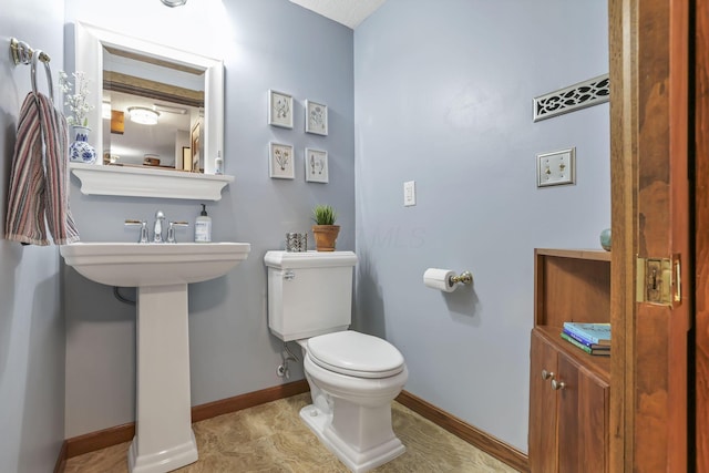 680 Rainbow Dr NW, Lancaster, OH 43130 - bathroom featuring toilet and baseboards