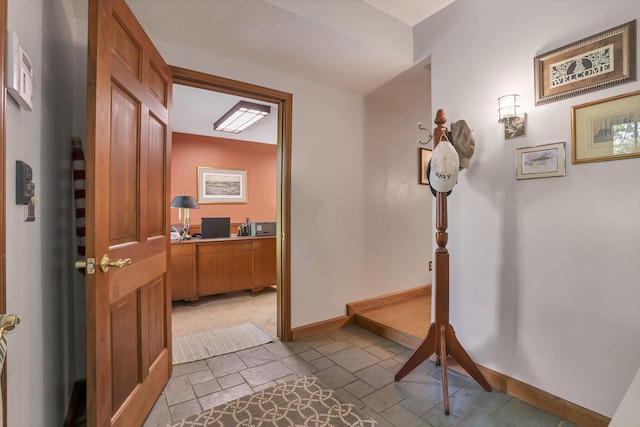 680 Rainbow Dr NW, Lancaster, OH 43130 - hall with stone tile flooring and an office area