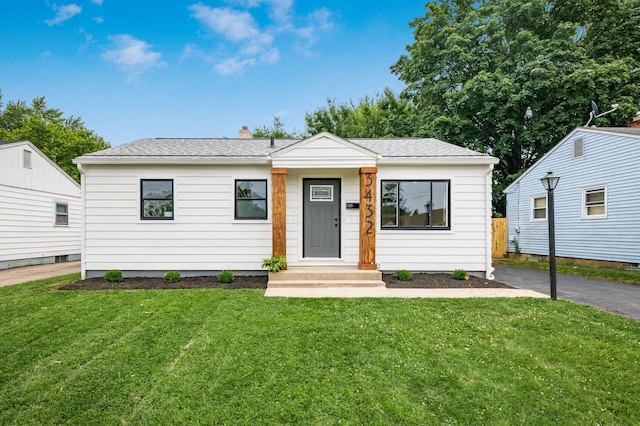 3432 Walmar Dr, Columbus, OH 43224 - view of front of home with a front yard and asphalt driveway