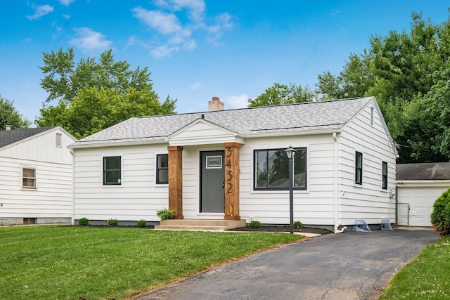 3432 Walmar Dr, Columbus, OH 43224 - view of front of home featuring a chimney, a shingled roof, and a front yard