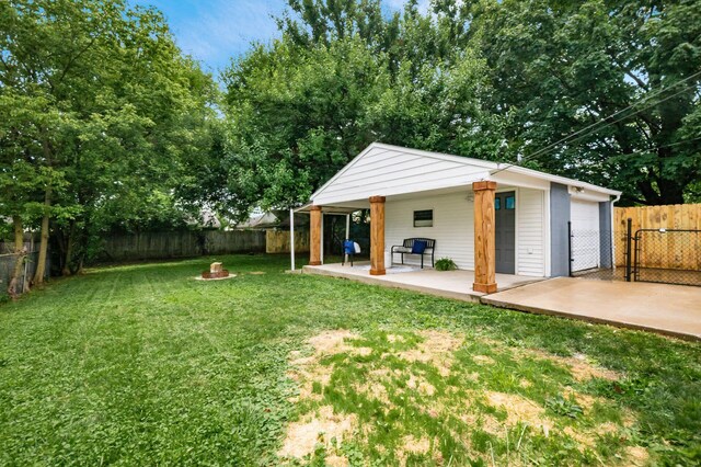 3432 Walmar Dr, Columbus, OH 43224 - fenced backyard with a fire pit, a patio area, and an outdoor structure