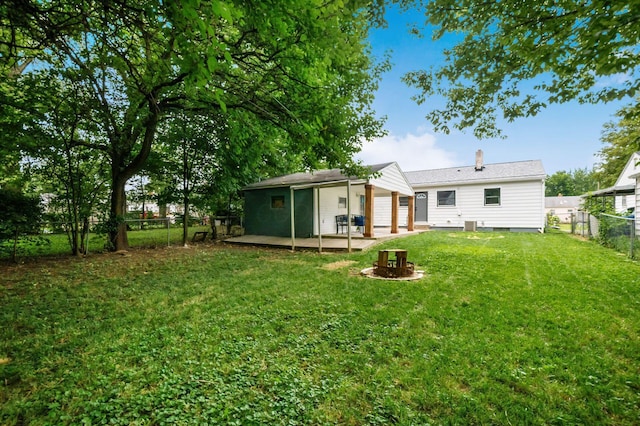 3432 Walmar Dr, Columbus, OH 43224 - rear view of house featuring a fenced backyard, a patio, and a chimney