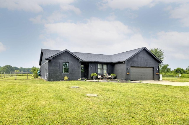 9710 Butcher Rd, Mount Vernon, OH 43050 - ranch-style house with driveway, a garage, a front yard, and a shingled roof