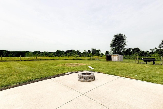 9710 Butcher Rd, Mount Vernon, OH 43050 - view of patio with a fire pit and a storage unit