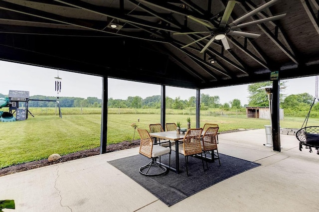 9710 Butcher Rd, Mount Vernon, OH 43050 - view of patio / terrace with outdoor dining space, ceiling fan, and an outbuilding