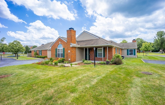 594 Chardonnay Ln, Lewis Center, OH 43035 - single story home featuring a chimney, brick siding, and a shingled roof
