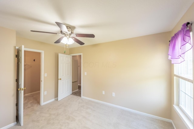 594 Chardonnay Ln, Lewis Center, OH 43035 - unfurnished bedroom with multiple windows, light colored carpet, and a spacious closet