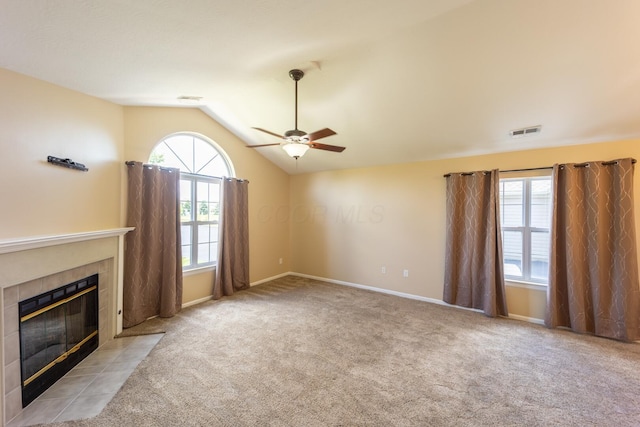 594 Chardonnay Ln, Lewis Center, OH 43035 - unfurnished living room featuring a ceiling fan, carpet floors, healthy amount of natural light, vaulted ceiling, and a fireplace