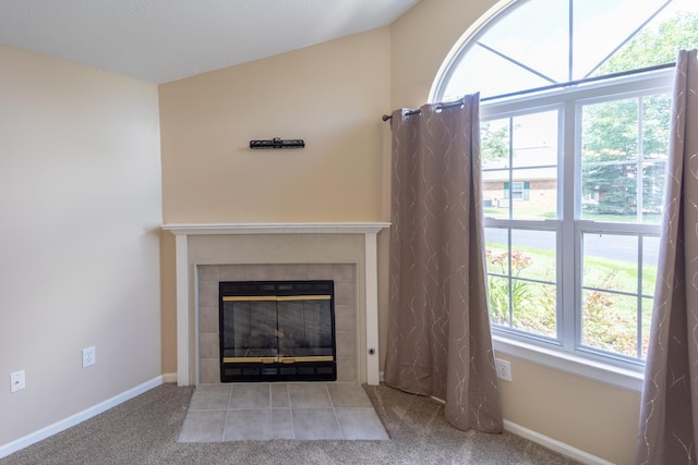 594 Chardonnay Ln, Lewis Center, OH 43035 - detailed view of a tiled fireplace and carpet flooring