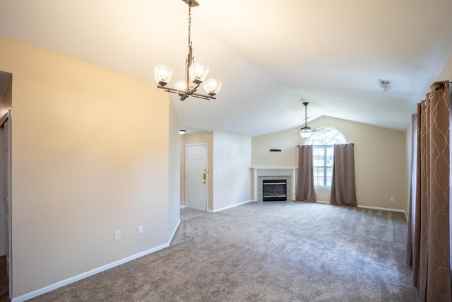 594 Chardonnay Ln, Lewis Center, OH 43035 - unfurnished living room featuring lofted ceiling, carpet, a fireplace, and a chandelier