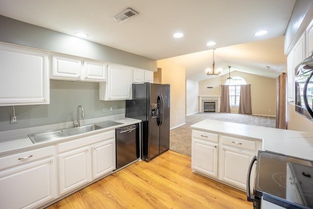 594 Chardonnay Ln, Lewis Center, OH 43035 - kitchen with black appliances, lofted ceiling, light wood finished floors, white cabinets, and recessed lighting