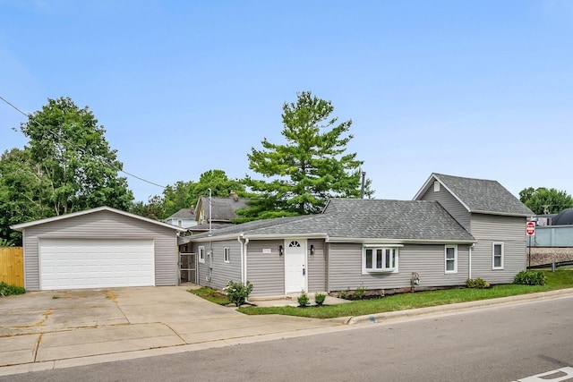 114 N Trine St, Canal Winchester, OH 43110 - view of front of home featuring a detached garage, an outbuilding, and roof with shingles