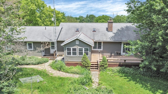 8421 Ransom Rd, Mount Vernon, OH 43050 - rear view of property with a deck, a chimney, a shingled roof, and a lawn
