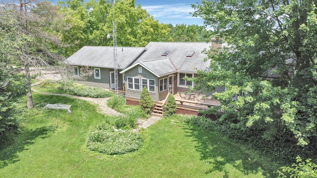 8421 Ransom Rd, Mount Vernon, OH 43050 - back of house with a wooden deck, a chimney, and a lawn