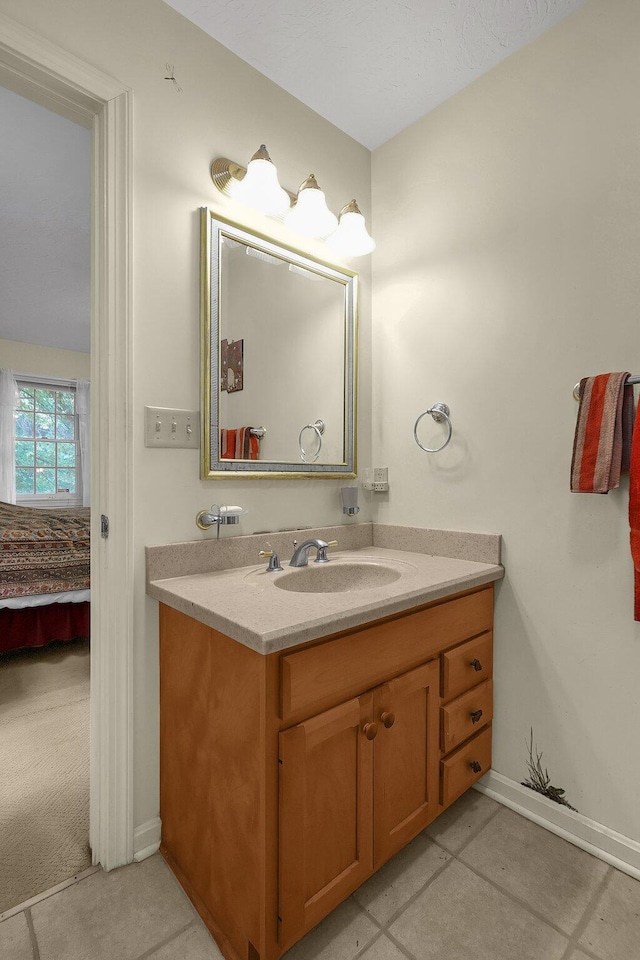 8421 Ransom Rd, Mount Vernon, OH 43050 - ensuite bathroom with vanity and baseboards