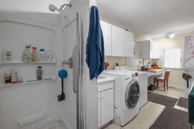 8421 Ransom Rd, Mount Vernon, OH 43050 - washroom with light tile patterned floors, separate washer and dryer, and cabinet space