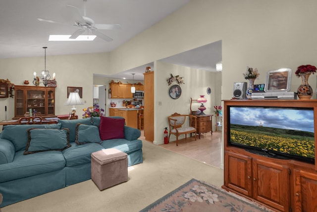 8421 Ransom Rd, Mount Vernon, OH 43050 - living area with vaulted ceiling, ceiling fan, light carpet, a chandelier, and a skylight