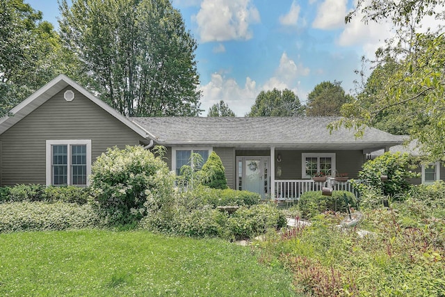 8421 Ransom Rd, Mount Vernon, OH 43050 - ranch-style house with a front yard and covered porch