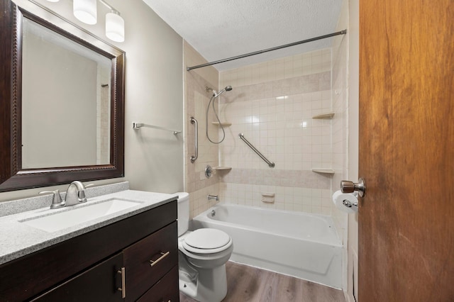 2468 Spaatz Ave, Columbus, OH 43204 - bathroom featuring  shower combination, vanity, wood finished floors, and a textured ceiling