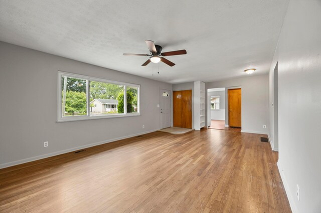 2468 Spaatz Ave, Columbus, OH 43204 - unfurnished living room featuring ceiling fan and light wood-type flooring