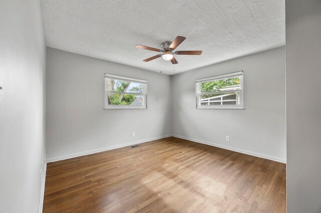 2468 Spaatz Ave, Columbus, OH 43204 - spare room with a ceiling fan, wood finished floors, and a textured ceiling