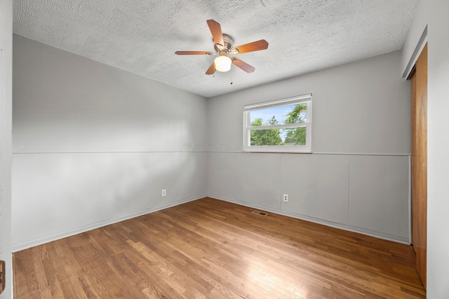 2468 Spaatz Ave, Columbus, OH 43204 - unfurnished bedroom with wood finished floors, a textured ceiling, and ceiling fan