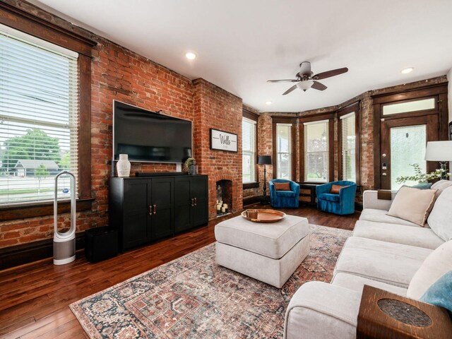119 Miami Ave Unit 119, Columbus, OH 43203 - living room featuring a ceiling fan, brick wall, wood finished floors, and a fireplace
