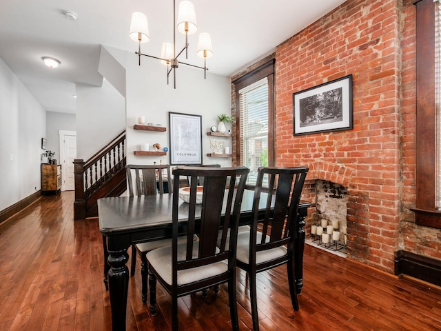 119 Miami Ave Unit 119, Columbus, OH 43203 - dining area featuring stairs, hardwood / wood-style floors, and a chandelier