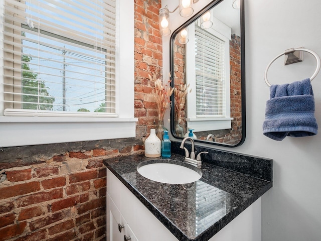 119 Miami Ave Unit 119, Columbus, OH 43203 - bathroom with brick wall and vanity